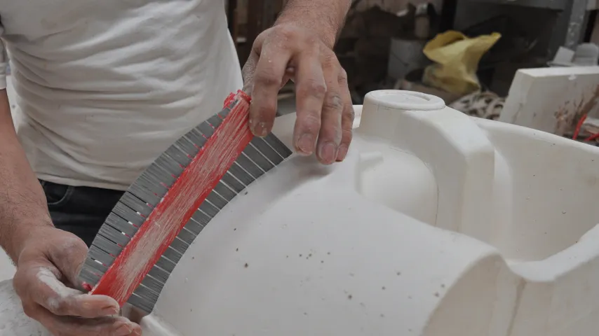close up porcelain fabrication worker hands.