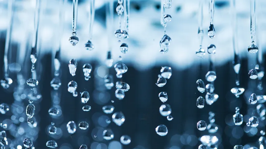 close up water droplets from showerhead.