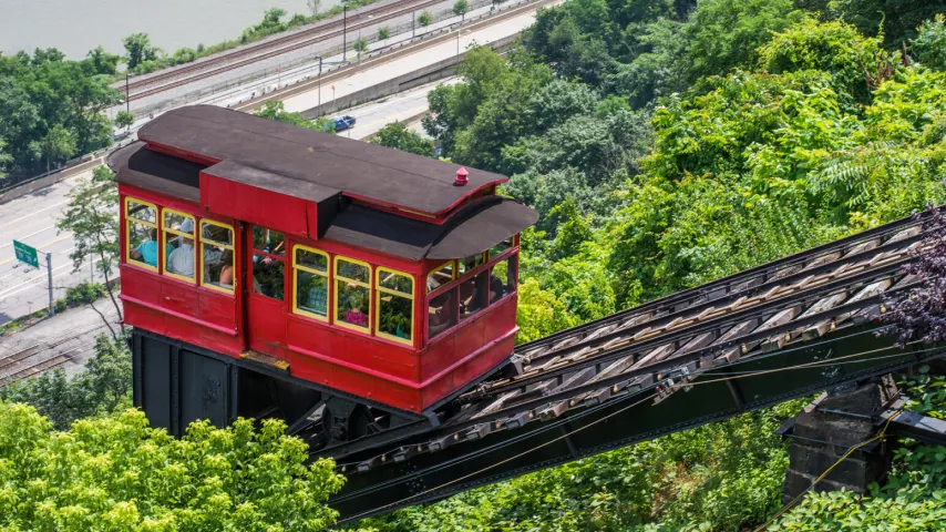 Pittsburgh funicular tram climbing tracks up hill.