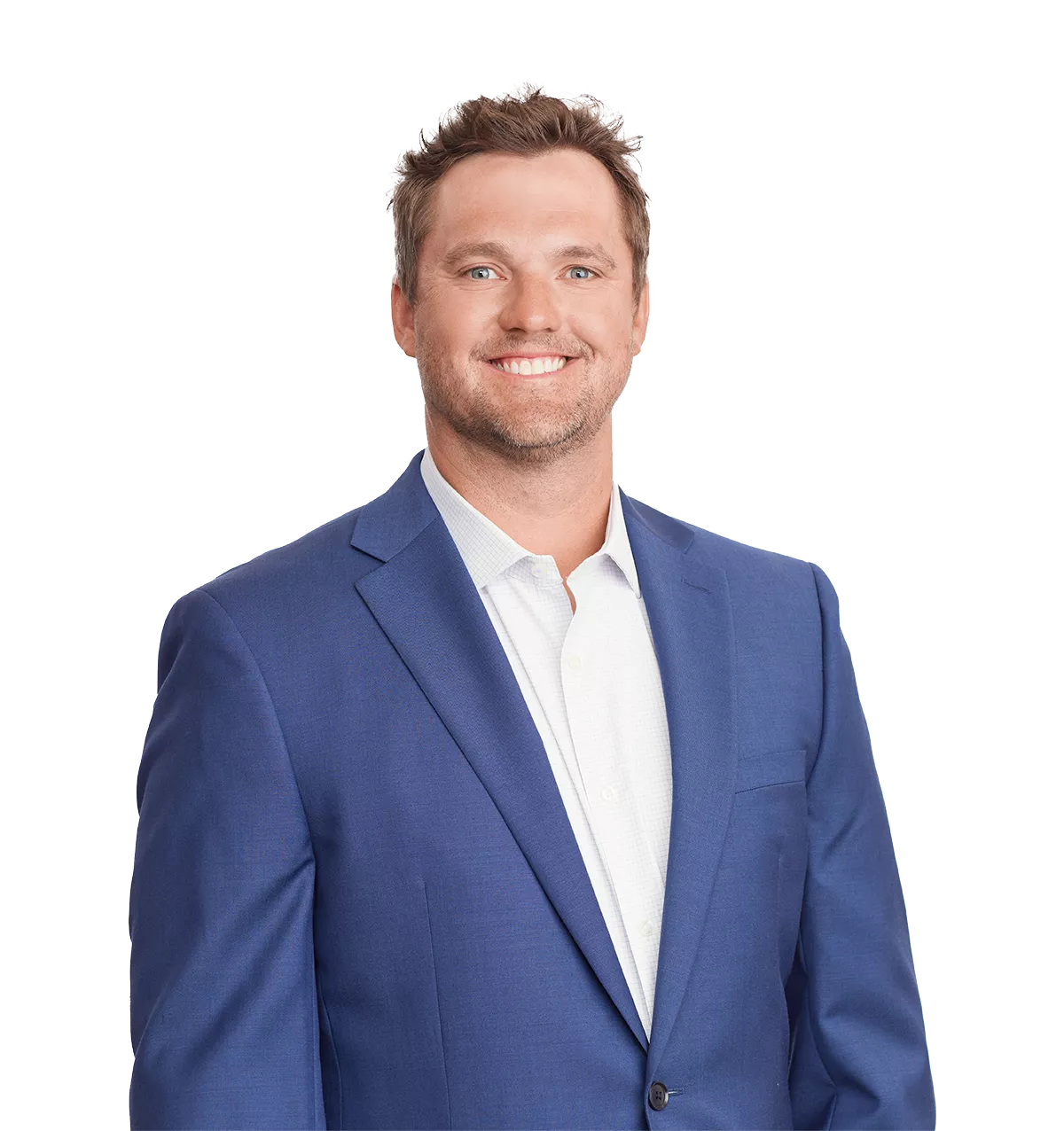 smiling man in a blue suit jacket and white shirt stands against a plain white background.