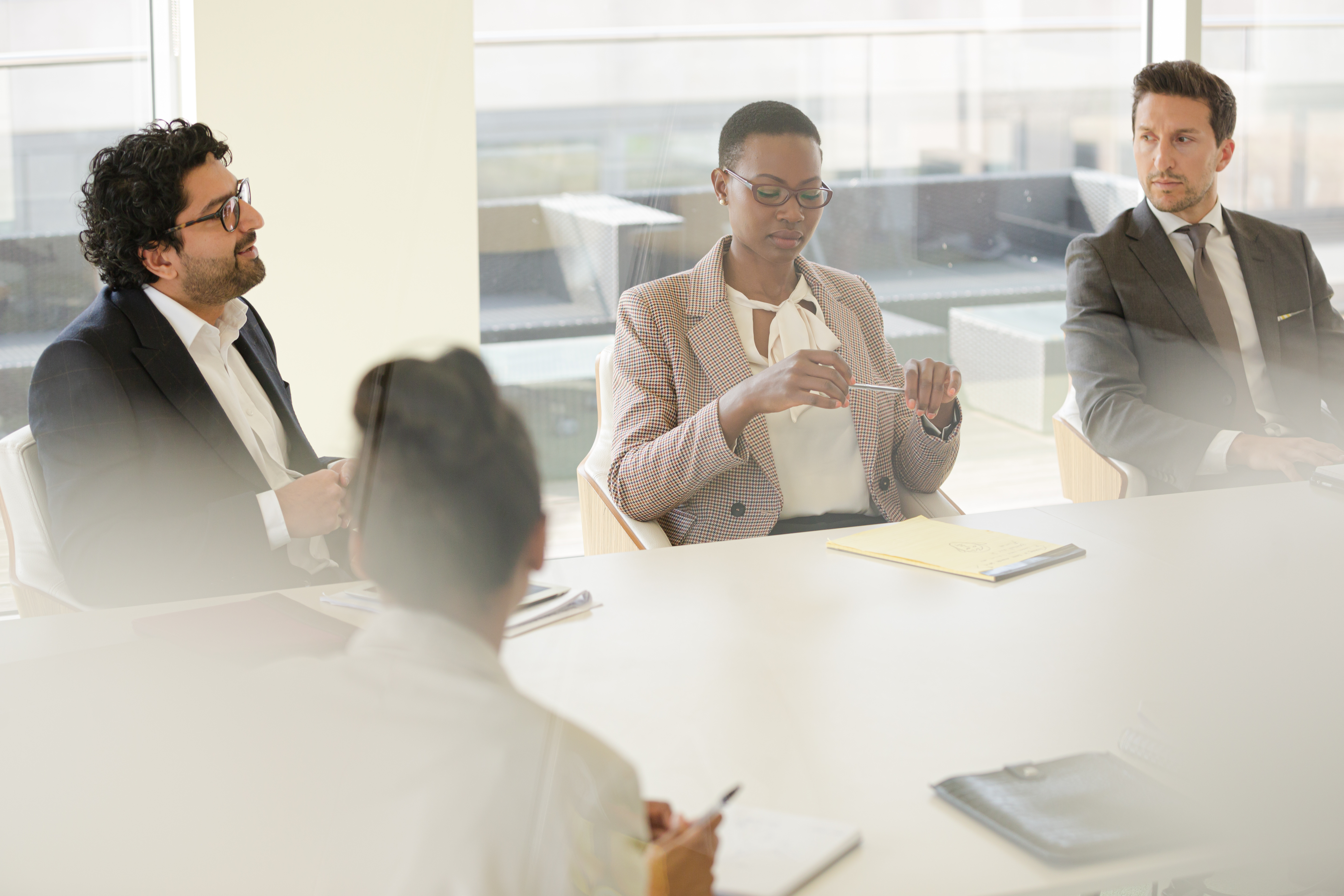 Group of people discussing in conference room