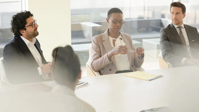 Group of people discussing in conference room