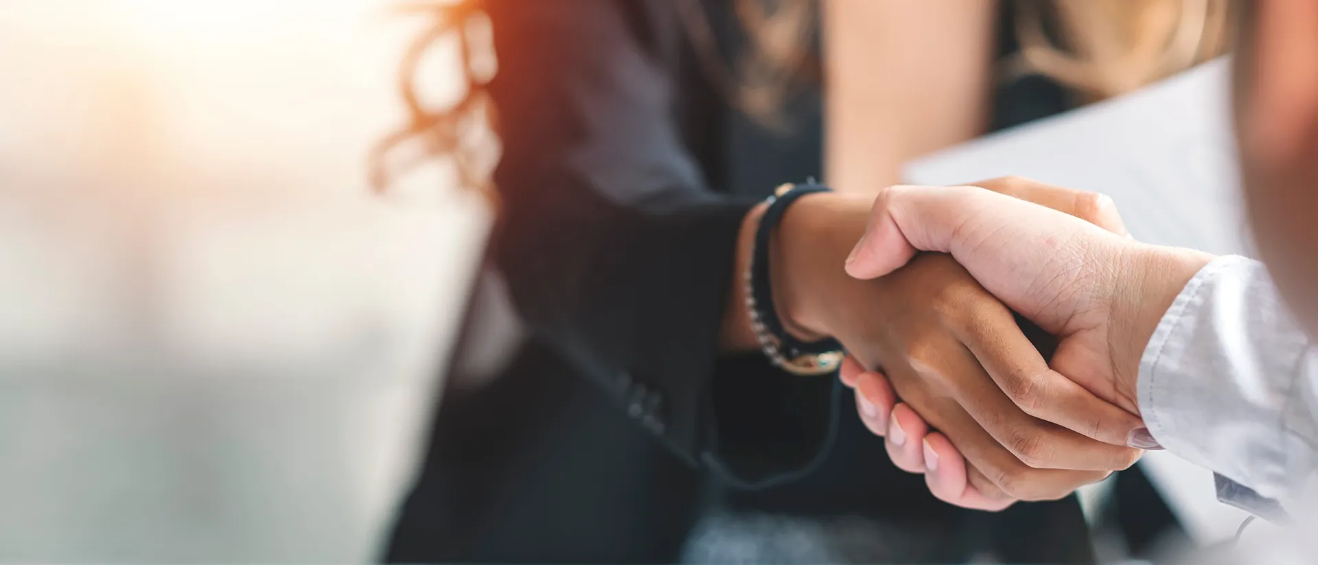 two people shake hands after business services agreement