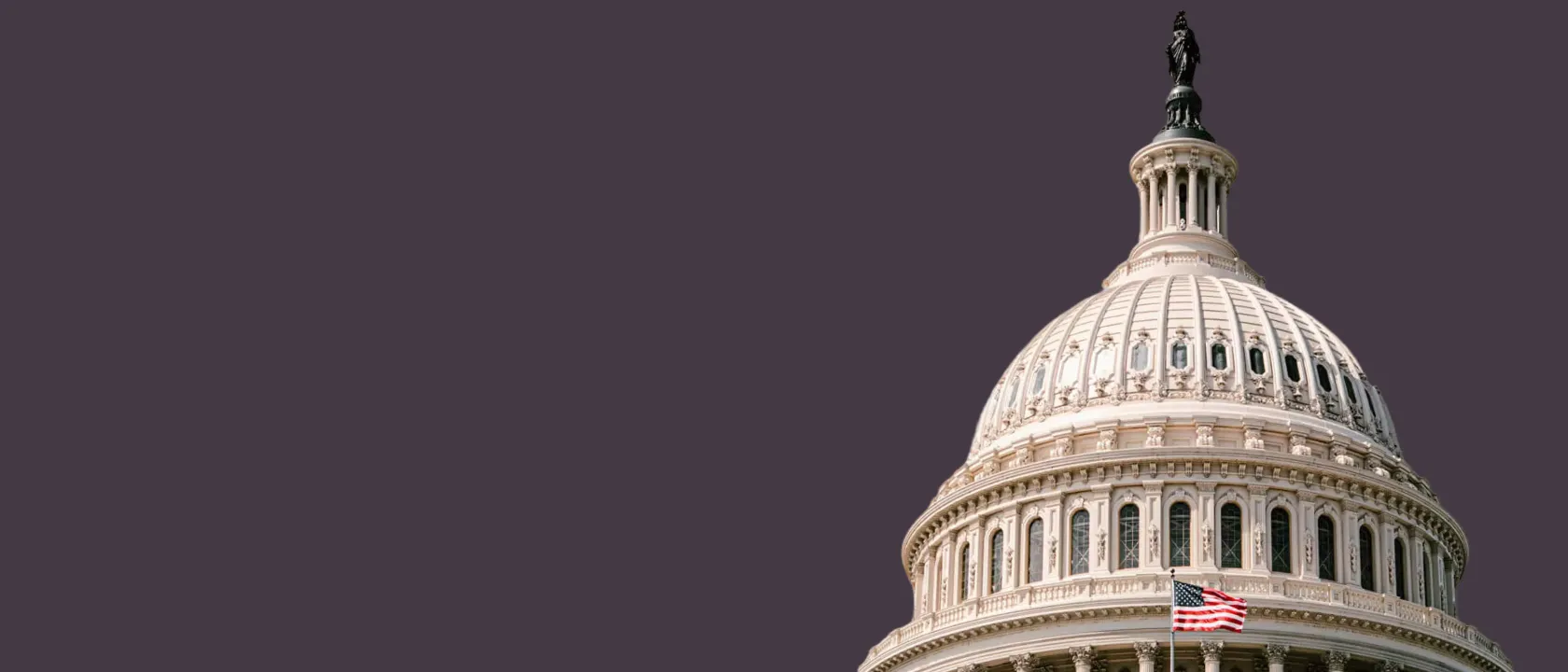 state-capitol-building-dome-with-US-flag-blowing