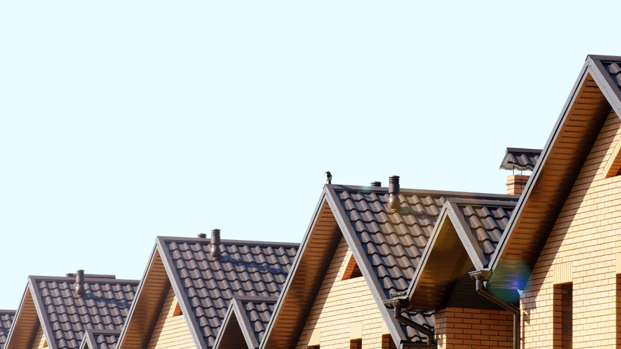 row-of-home-rooftops-with-similar-style-roofs