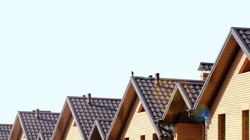 row-of-home-rooftops-with-similar-style-roofs