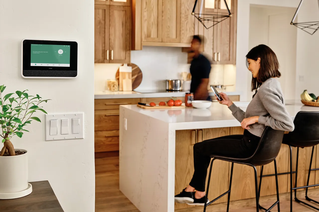 Vivint smart hub on wall in home kitchen area.