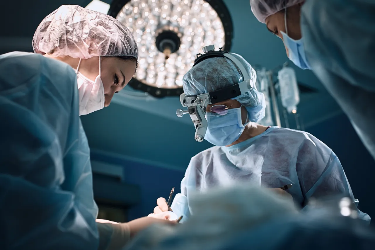 medical-team-operating-room-in-masks-surgery