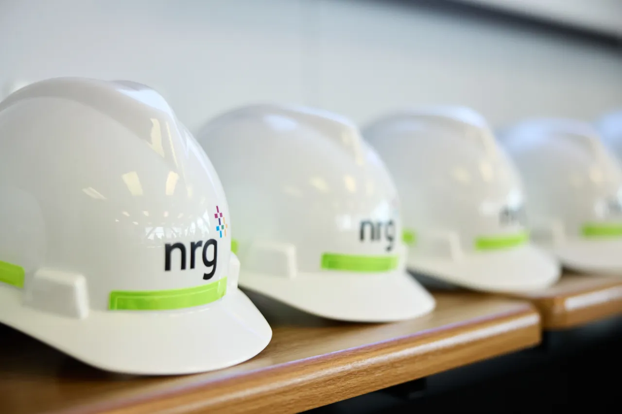 nrg-energy-powerplant-hardhats-lined-up-on-shelf