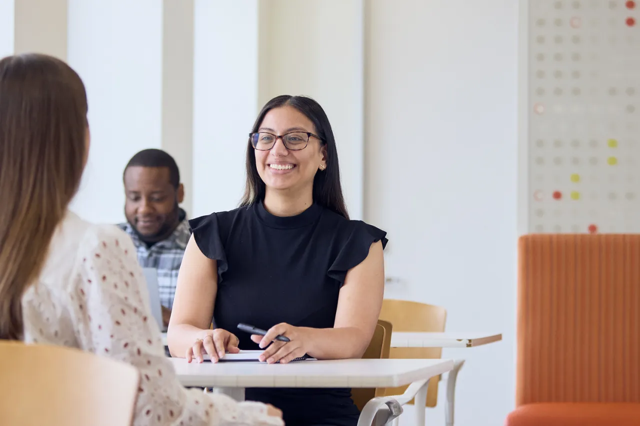 group of employees talking at work.