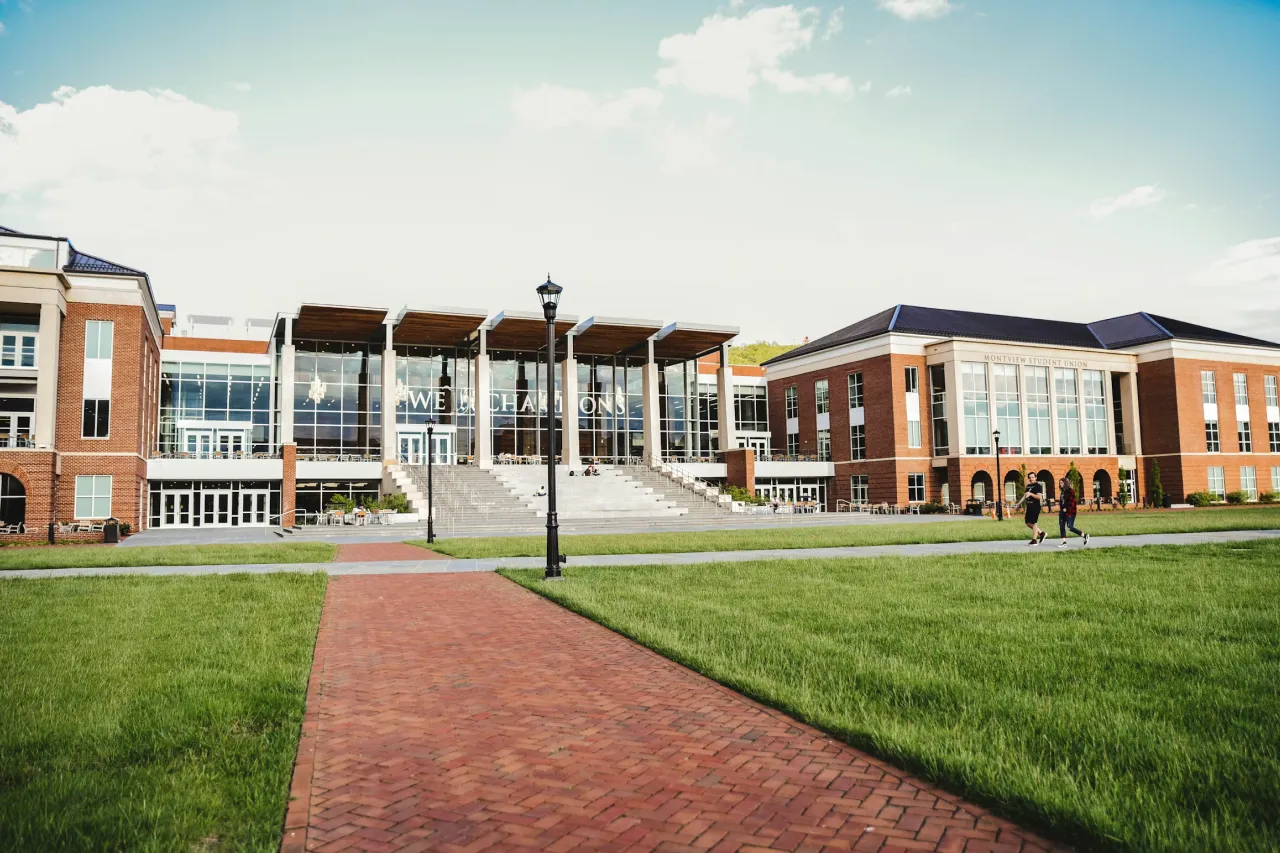 campus commons building with students walking outside.