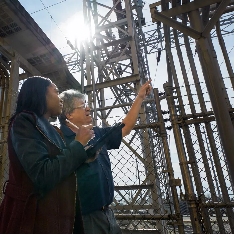 calspan-employees-examining-power-supply-station