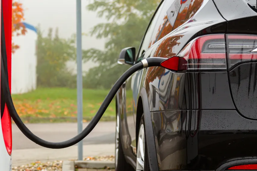 ev car charging at charging station.