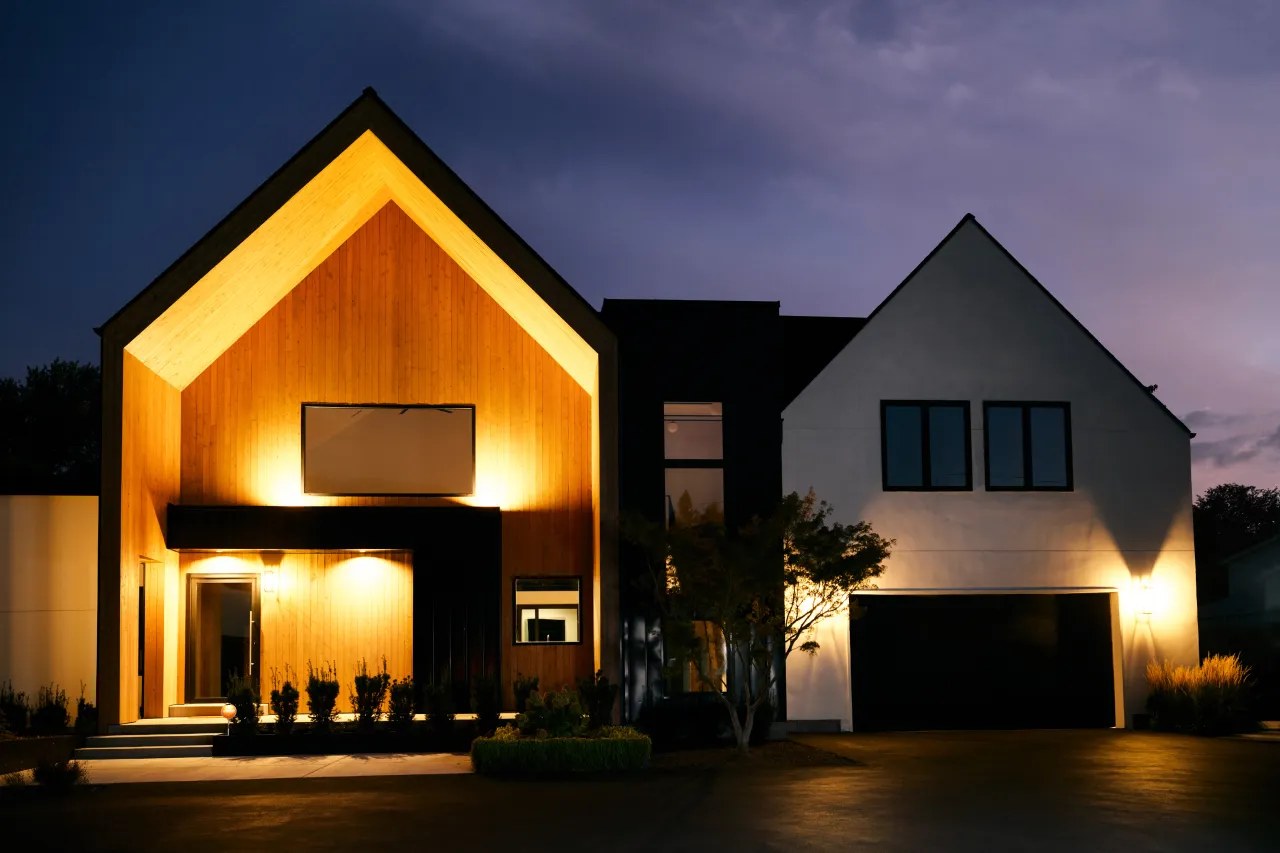 modern home at dusk with outdoor lighting.