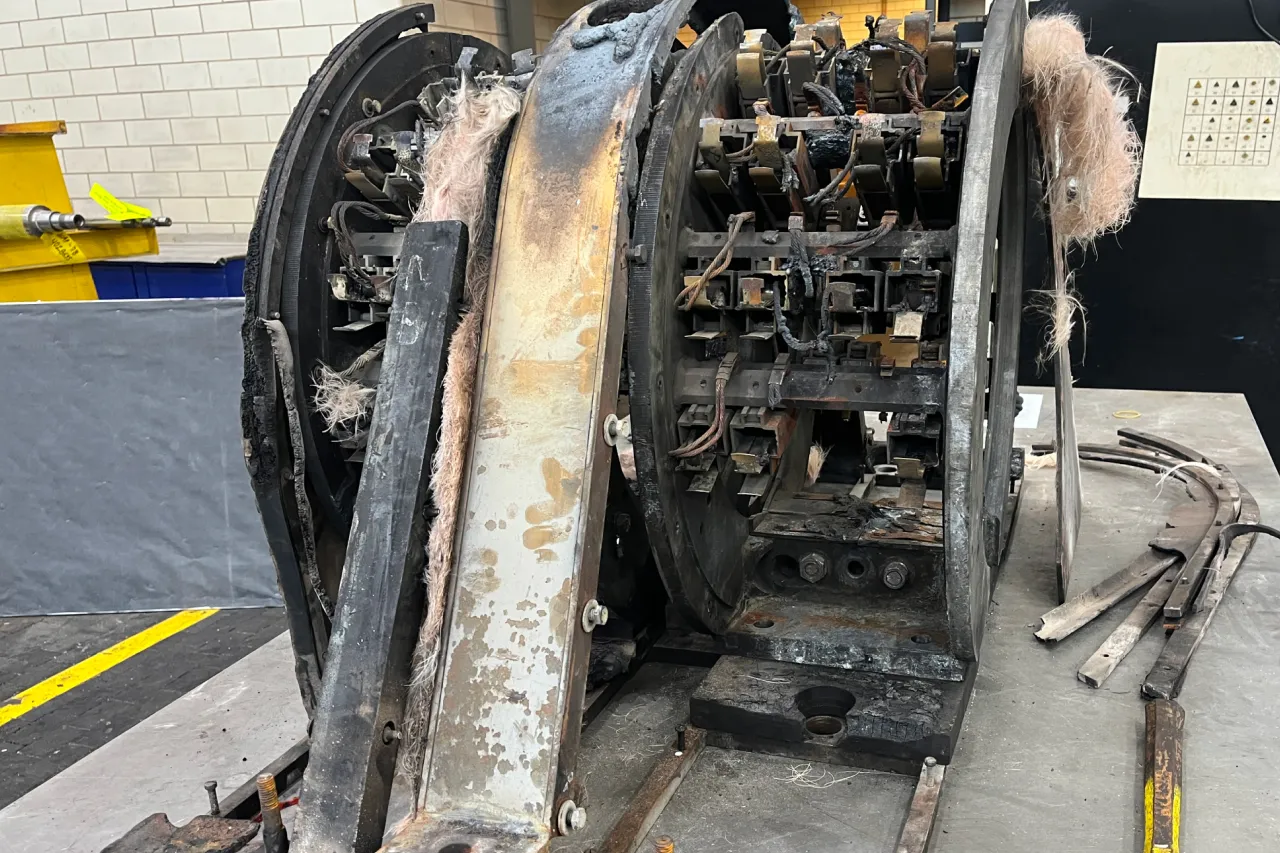 destroyed original exciter brush rigging assembly.
