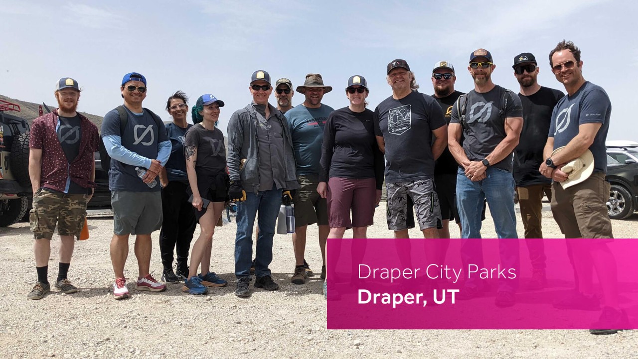 a group of people pose outside in casual attire at Draper City Parks in Draper, UT on a sunny day.